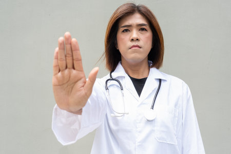 Portrait of Asian transgender non binary doctor with stethoscope. Diversity in healthcare.の写真素材