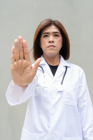 Portrait of Asian transgender non binary doctor with stethoscope. Diversity in healthcare.の写真素材