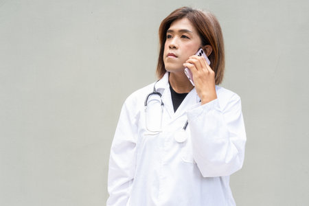 Portrait of Asian transgender non binary doctor with stethoscope. Diversity in healthcare.の写真素材