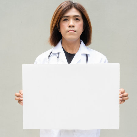 Portrait of Asian transgender non binary doctor with stethoscope. Diversity in healthcare.の写真素材