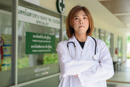 Portrait of Asian transgender non binary doctor with stethoscope. Diversity in healthcare.の写真素材
