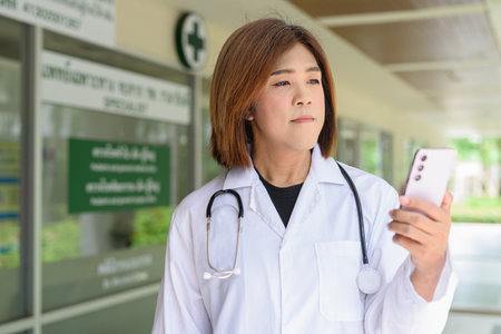 Portrait of Asian transgender non binary doctor with stethoscope. Diversity in healthcare.の写真素材