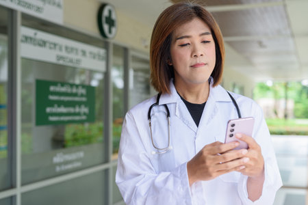 Portrait of Asian transgender non binary doctor with stethoscope. Diversity in healthcare.の写真素材
