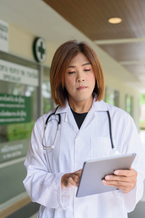 Portrait of Asian transgender non binary doctor with stethoscope. Diversity in healthcare.の写真素材