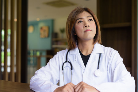 Portrait of Asian transgender non binary doctor with stethoscope. Diversity in healthcare.の写真素材