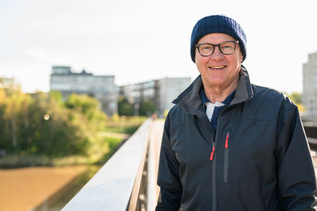 Portrait of a smiling senior man on the bridgeの写真素材