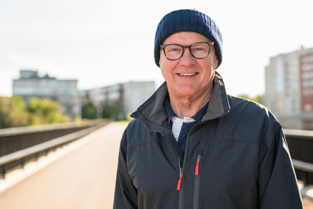 Portrait of a smiling senior man on the bridgeの写真素材