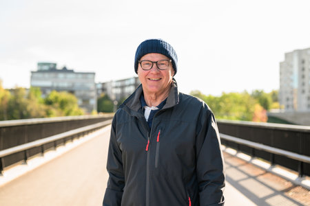 Portrait of a smiling senior man on the bridgeの写真素材