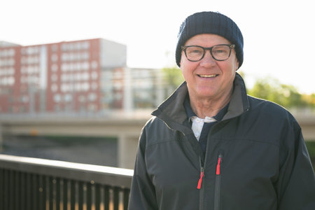 Portrait of a smiling senior man on the bridge