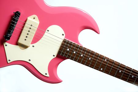 A pink electric guitar isolated against a white background in the horizontal format.の写真素材