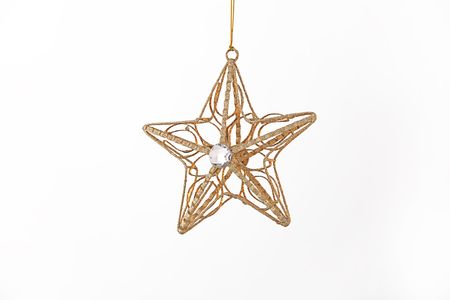 A gold Christmas star ornament isolated against a white background.の写真素材