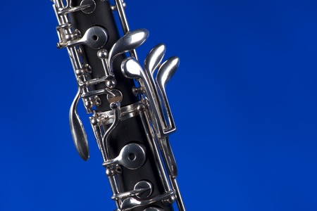 An oboe up close isolated against a blue background in the horizontal format with copy space.の写真素材