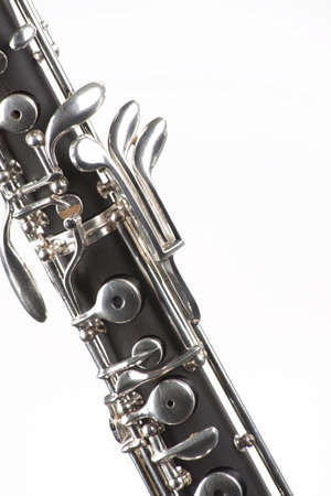 An oboe woodwind instrument isolated against a white background in the vertical format.の写真素材
