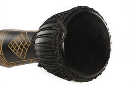 A black djembe conga drum isolated against a white background.
