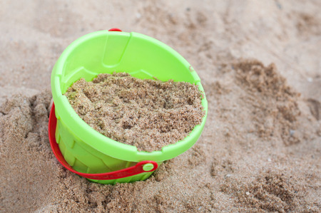 children bucket toy on the beachの写真素材