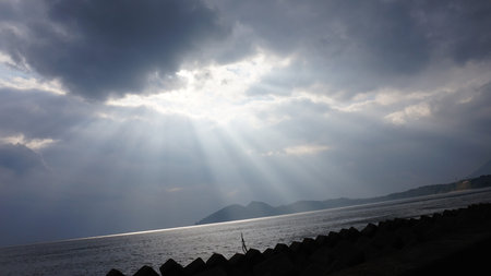 Crepuscular Rays, God Rays. Sun Shining Through Clouds at Kumamoto, Japan