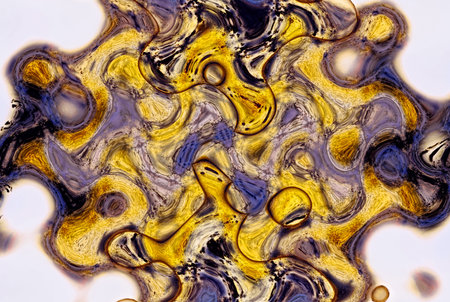 abstract background with yellow and black spots and spots of oil paint