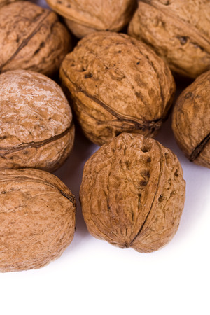 Walnuts close up isolated on white backgroundの写真素材