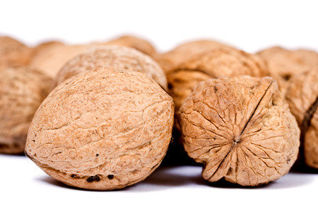 Walnuts close up isolated on white backgroundの写真素材