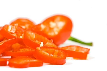 sliced red hot jalapeno pepper over whiteの写真素材