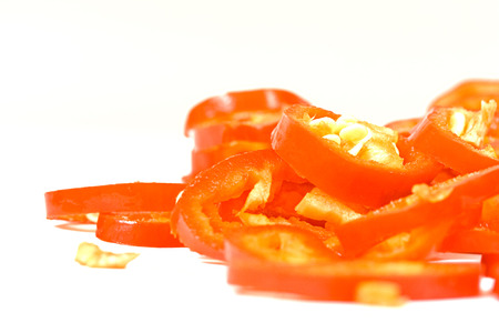 sliced red hot jalapeno pepper over whiteの写真素材