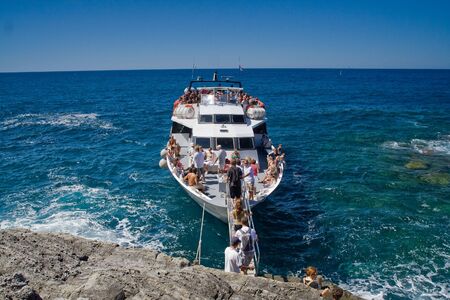 Cruise ship at the waterfront - Corniglia, Cinque Terre, Italyの写真素材