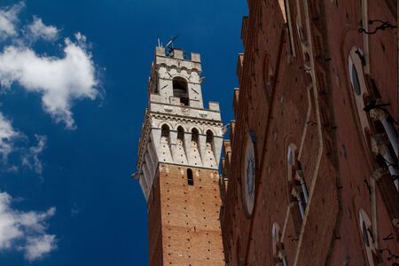 Torre del Mangia in Siena - Tuscany, Italyの写真素材
