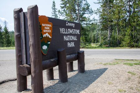 Yellowstone, Wyoming - July 1 2018: Sign notifying park visitors that they are leaving Yellowstone National Parkの写真素材