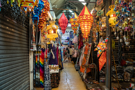 Bangkok, Thailand - November 30, 2019: Stalls selling trinkets and clothing inside an aisle at the Chatuchak Weekend Marketのeditorial素材