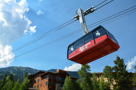 JULY 10 2018 - JACKSON WYOMING: The Jackson Hole Ski Resort gondola aerial tram takes visitors up the mountain during the summer for sightseeing, scenic views and hiking.のeditorial素材