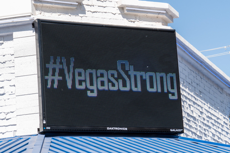 OCT 13 2017 LAS VEGAS NV: #Vegas Strong banner message, flowers and gifts at the memorial park by the Mandalay Bay on the Vegas Strip to remember victims killed in the Las Vegas attack shootingのeditorial素材