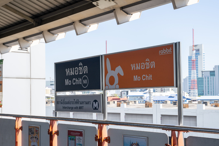 Bangkok, Thailand - November 30, 2019: Sign for the BTS Skytrain station Mo Chit (English translation from Thai - Mo Chit and Interchange with MRT)のeditorial素材
