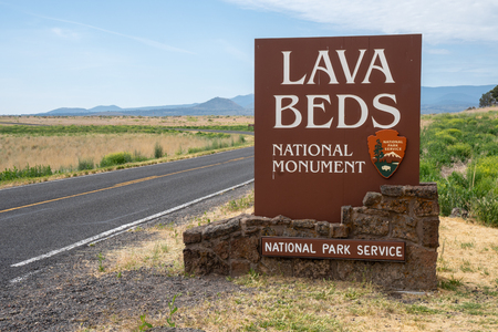 Tulelake, California - July 9, 2019: Entrance sign for Lava Beds National Monument in Northern California, allows visitors to enter underground cavesのeditorial素材