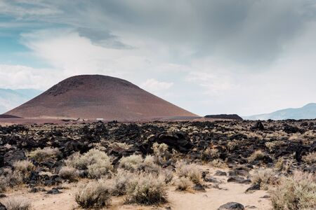 Fossil Falls formed years ago when the Owens River carved through the volcanic basalt rocks in the Eastern Sierra Nevada of Californiaの写真素材