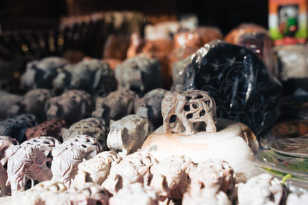 Hand carved marble elephant figurines for sale at Dilli Haat, a craft bazaar market in New Delhi Indiaの写真素材