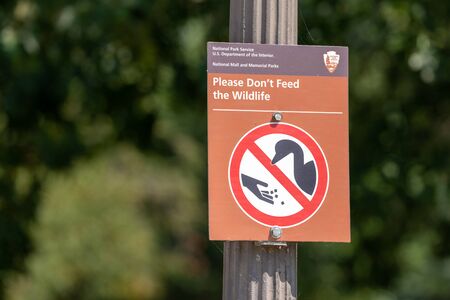 Washington, DC - August 6, 2019: Sign from the National Park Service reminds tourists not to feed the wildlifeの写真素材
