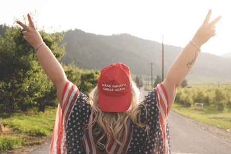 Wenatchee, Washington - July 4, 2019: Republican woman wearing a MAGA hat (Make America Great Again)...