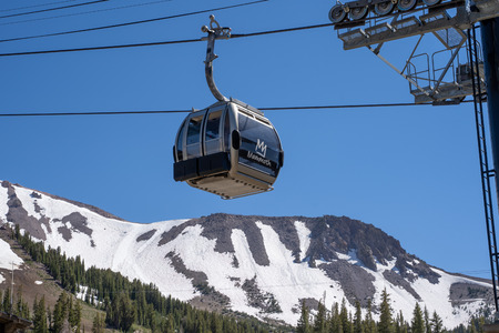 Mammoth Lakes, California - July 12, 2019:  Gondola chair lifts operate at Main Lodge at Mammoth Mountain Ski Area in the Eastern Sierra Nevada in the summerのeditorial素材