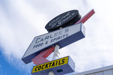 Borrego Springs, California - March 21, 2019: Retro vintage mid century style sign for Carlee's Food and Spirits, known for cocktails and char broiled steaksのeditorial素材