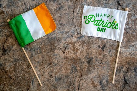 Happy St Patricks Day flag with an Ireland flag. Concept for St Patricks Day. Flatlay on marble backgroundの写真素材