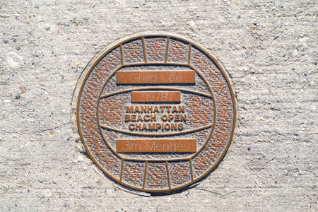 Manhattan Beach, California - March 26, 2019: Greg Lee and Jim Menges plaque honors the 1978 Manhattan Beach Open Volleyball Champions on the piers Walk of Fameのeditorial素材