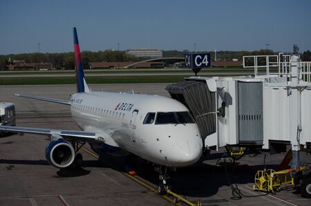 Minneapolis, MN - May 2 2018: A Delta Air Lines Delta Connection jet airplane waits at a gate at MSP International Airport for passengersのeditorial素材