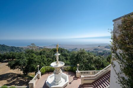 San Simeon, California - August 7, 2018: Famous golden girl statue overlooking the coastal mountains at the Hearst Castleのeditorial素材