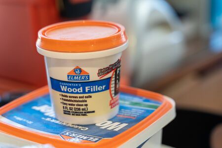 Minneapolis, Minnesota - April 24, 2019: Elmers Carpenter's Wood Filler, useful for filling holes and knicks in wood, and is paintable and stainable.のeditorial素材