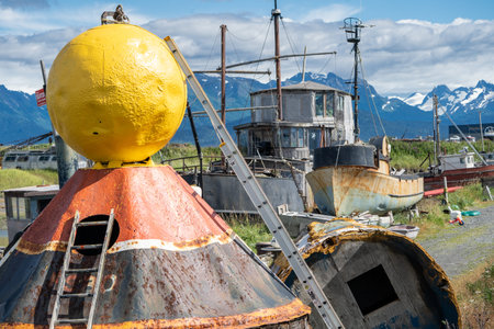 Abandoned boats, ships and other junk in a junkyard along Alaskas Homer Spit