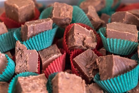 Individually wrapped chocolate fudge in fun Christmas holiday colorsの写真素材