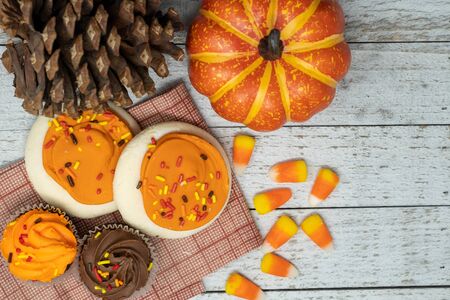 Pine cones and pumpkins, wooden backgroundの写真素材