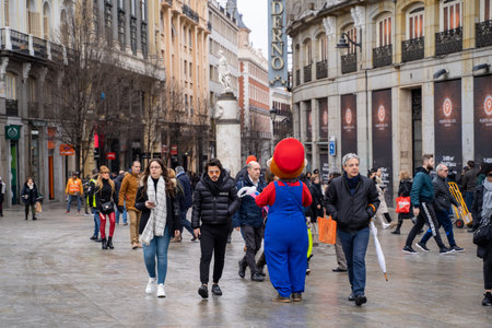 Madrid, Spain - January 25, 2020: Super Mario character harrasses tourists walking along the Plaza Mayor area of downtown Madridのeditorial素材