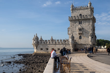 Lisbon, Portugal - January 17, 2020: Tourists visit Belem Tower, a UNESCO World Heritage Site and...