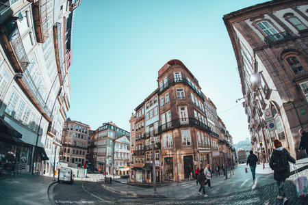 Porto, Portugal - January 20, 2020: Unique fisheye lens view of buildings and street life in the...